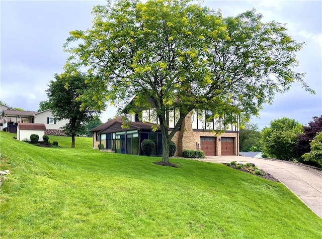291 Annuity Dr, South Franklin, PA 15301 - view of grassy yard featuring an attached garage and driveway