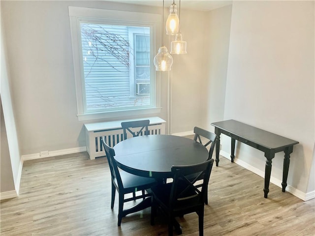 dining area with light hardwood / wood-style floors