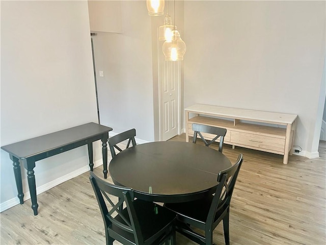 dining space featuring light hardwood / wood-style flooring