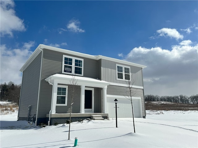 view of front of property with a garage