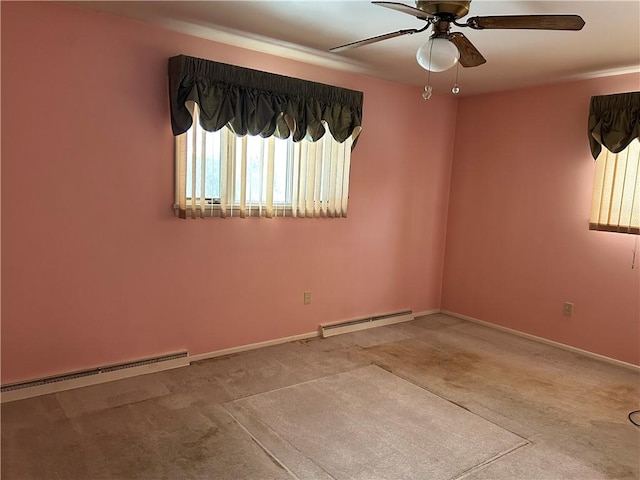 empty room featuring ceiling fan, baseboard heating, and light carpet