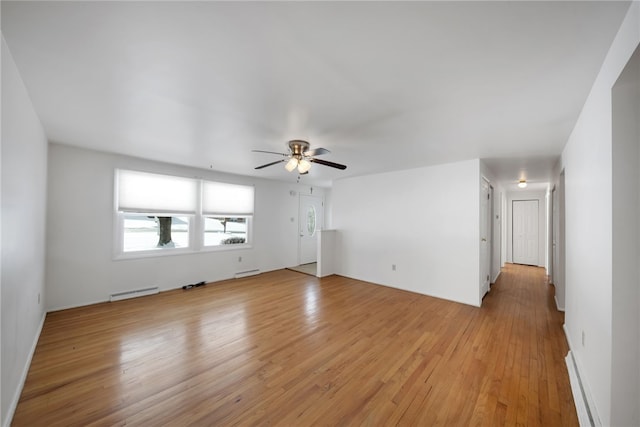 unfurnished living room with ceiling fan, baseboard heating, and light hardwood / wood-style flooring