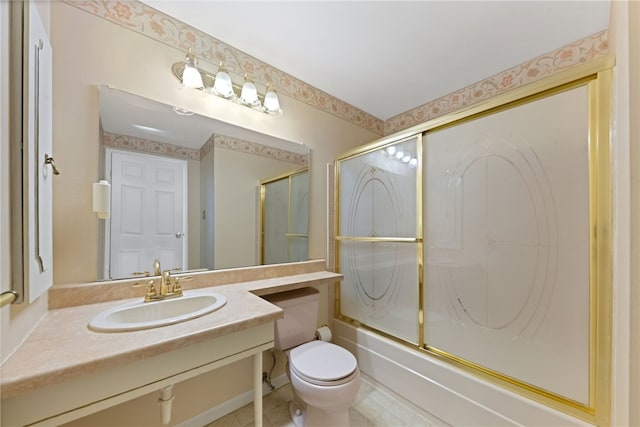 full bathroom featuring shower / bath combination with glass door, vanity, and toilet