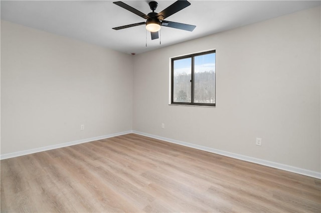 spare room with ceiling fan and light hardwood / wood-style flooring