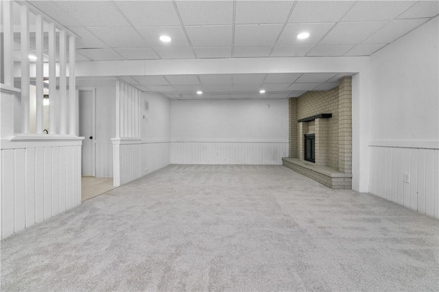 basement featuring light colored carpet