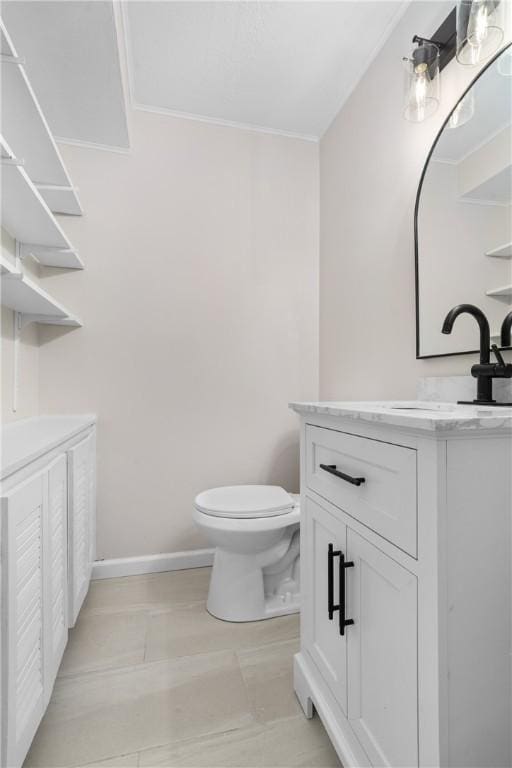 bathroom featuring tile patterned floors, toilet, and vanity