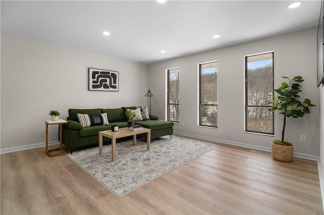 living room with light hardwood / wood-style floors