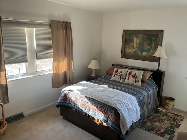 bedroom with light colored carpet