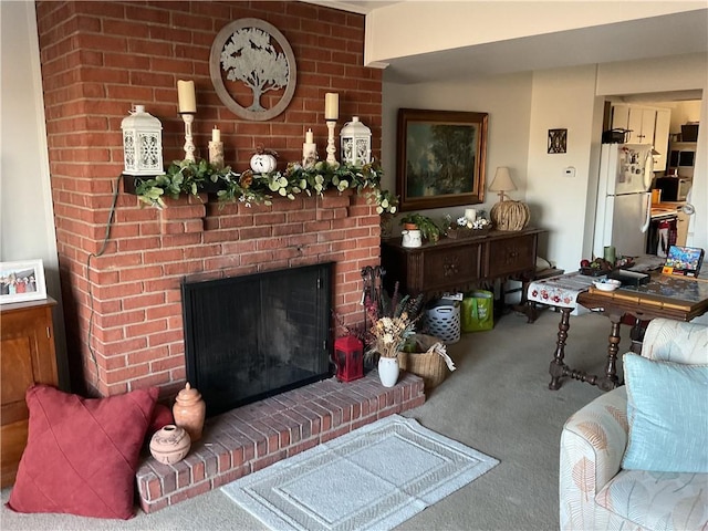 living room featuring carpet floors and a brick fireplace