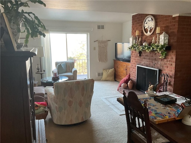 carpeted living room with a fireplace