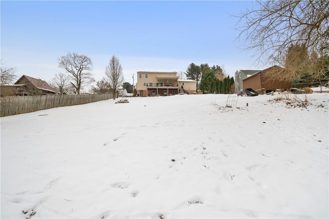 view of yard layered in snow