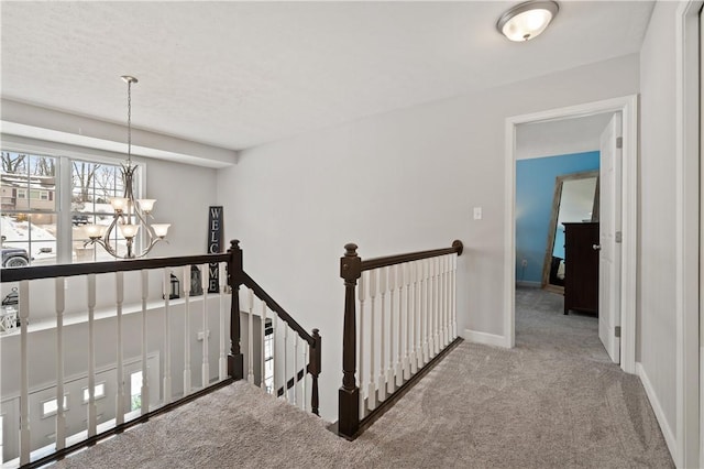 interior space featuring a chandelier and carpet floors