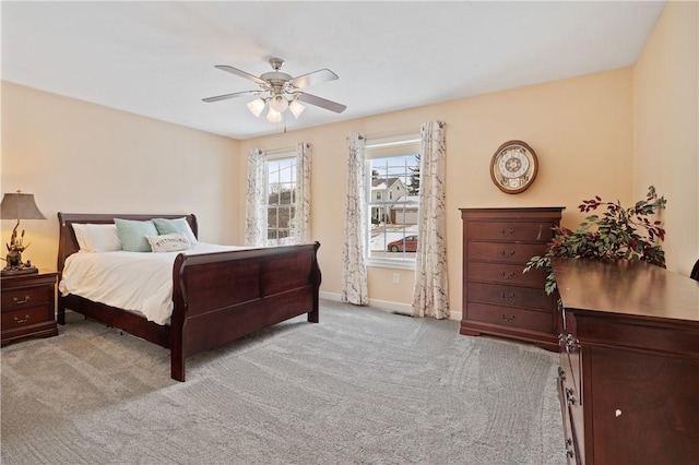 bedroom featuring ceiling fan and light colored carpet