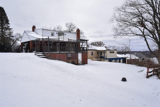 snow covered house with covered porch