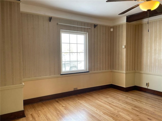 spare room with hardwood / wood-style flooring and ceiling fan