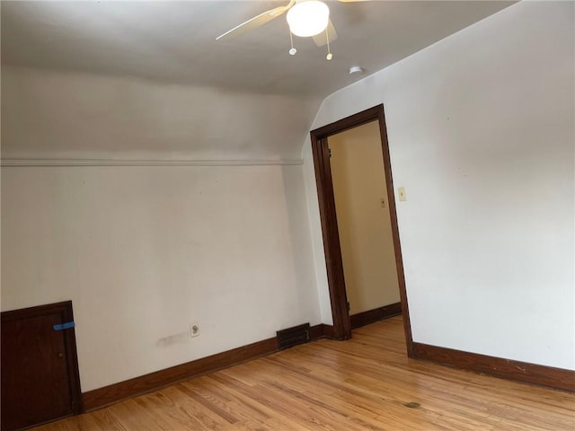 additional living space with ceiling fan, lofted ceiling, and light hardwood / wood-style flooring