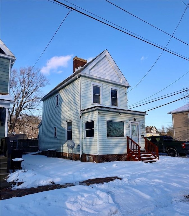 view of snow covered house