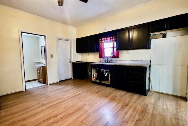 kitchen with light wood-type flooring and sink