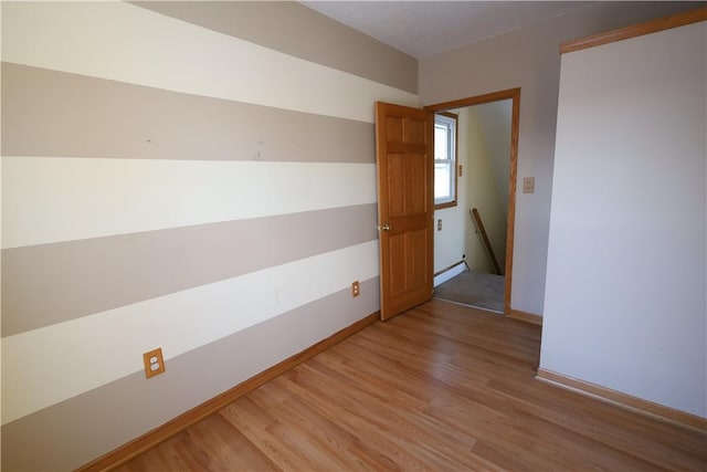 unfurnished room featuring light hardwood / wood-style flooring