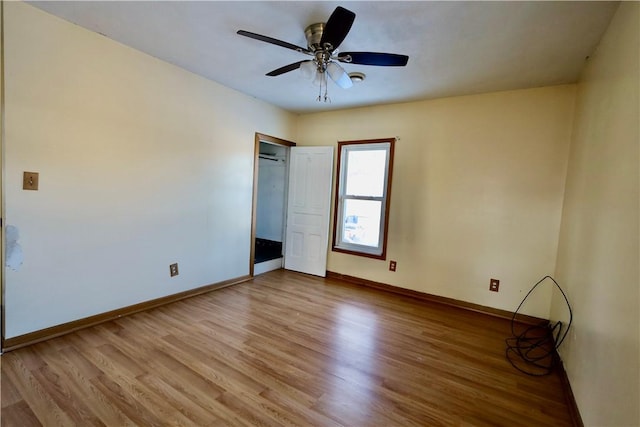 unfurnished bedroom with ceiling fan and light hardwood / wood-style flooring