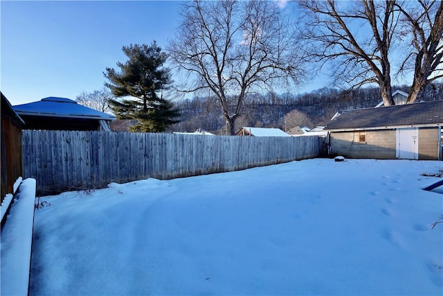 view of yard layered in snow