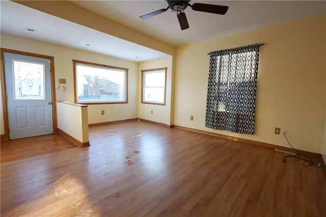 interior space with ceiling fan and light wood-type flooring