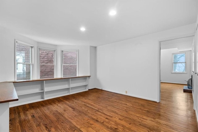 empty room with hardwood / wood-style floors