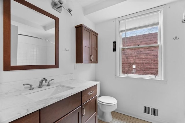 bathroom with toilet and vanity