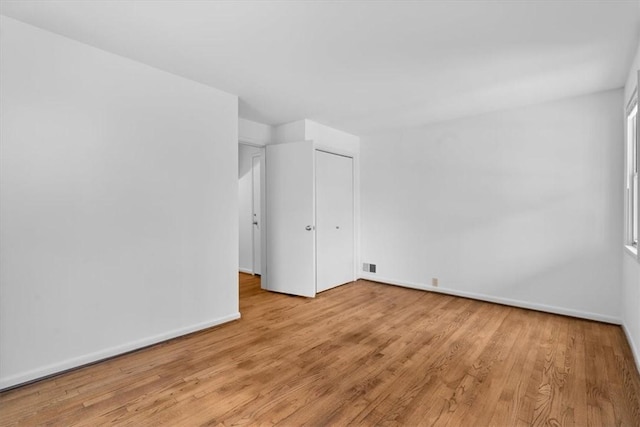 spare room with light wood-type flooring