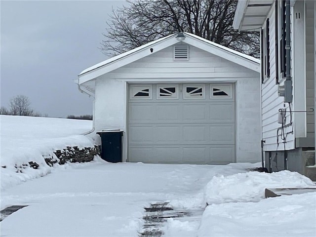 view of snow covered garage