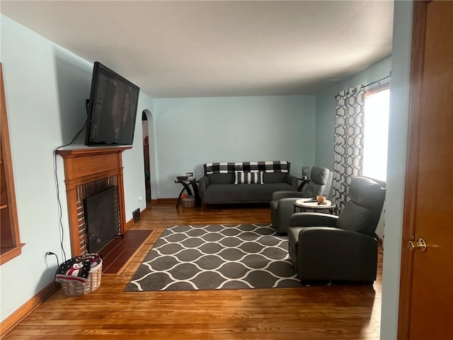 living room with dark hardwood / wood-style floors