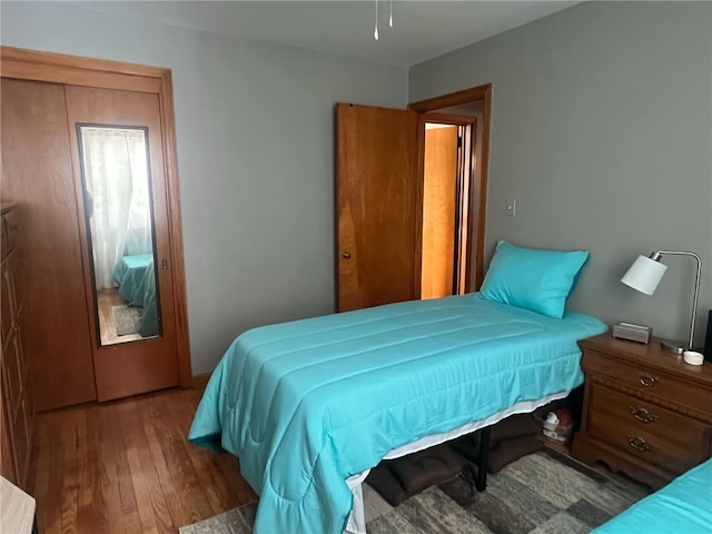 bedroom with hardwood / wood-style floors