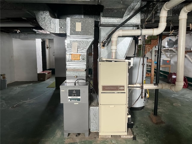 utility room with water heater and heating unit