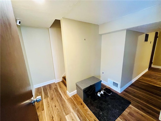 exercise room featuring wood-type flooring