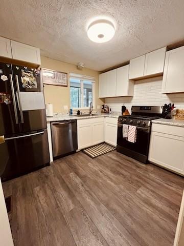 kitchen with white cabinetry, appliances with stainless steel finishes, and sink