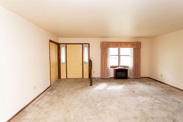 spare room featuring carpet flooring