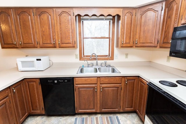 kitchen with black appliances and sink