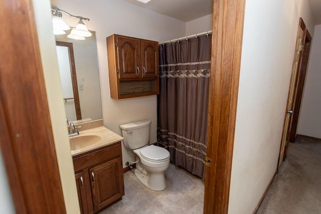 bathroom featuring toilet and vanity