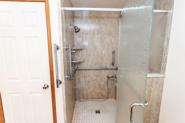 bathroom featuring walk in shower and tile patterned flooring