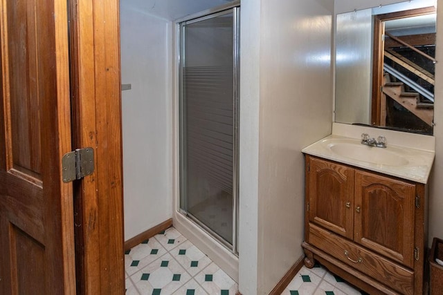 bathroom with an enclosed shower and vanity