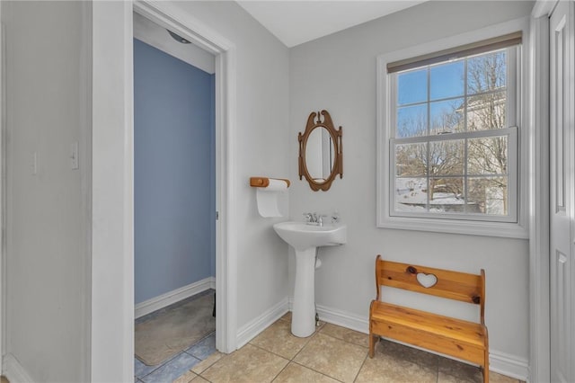 bathroom with tile patterned flooring and sink