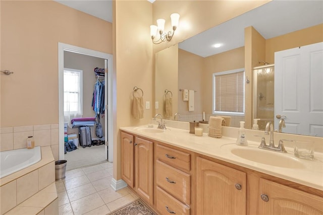 bathroom with independent shower and bath, tile patterned flooring, and vanity