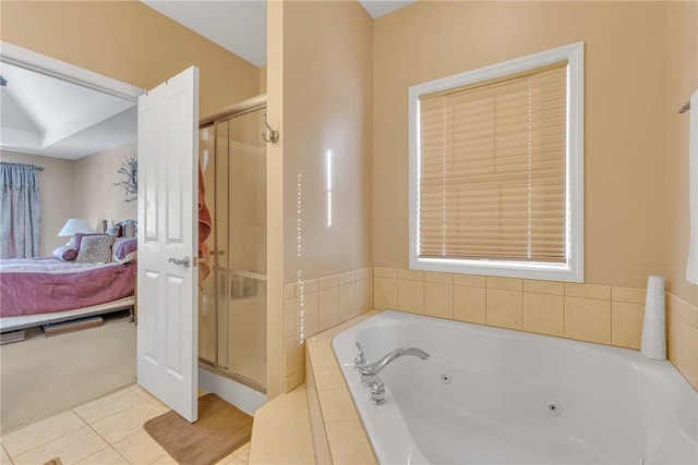 bathroom with tile patterned flooring and separate shower and tub