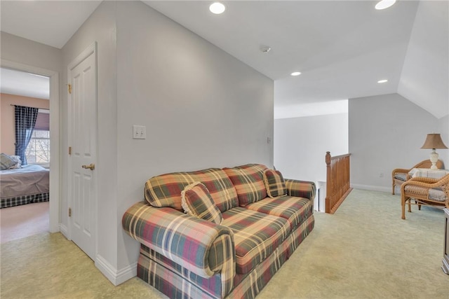 carpeted living room featuring vaulted ceiling