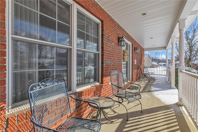 balcony featuring a porch