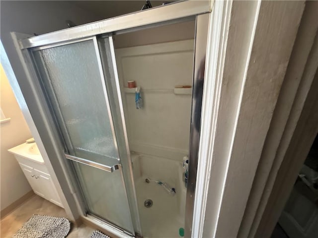 bathroom with a shower with shower door