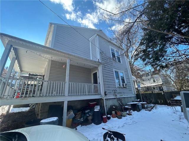 view of snow covered exterior featuring covered porch