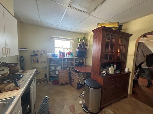 kitchen with a drop ceiling and sink