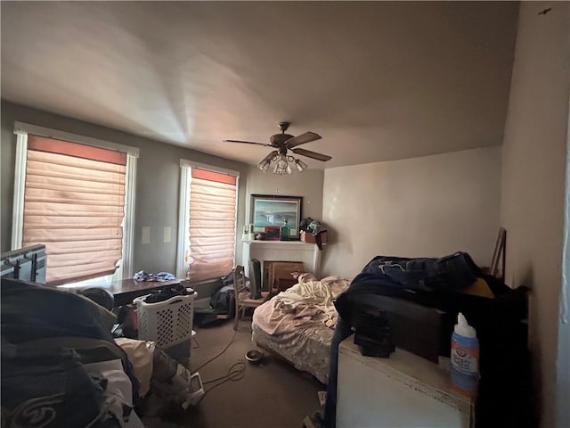 bedroom with ceiling fan and carpet flooring