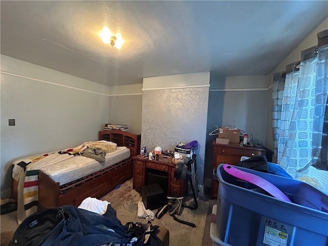 bedroom featuring light colored carpet